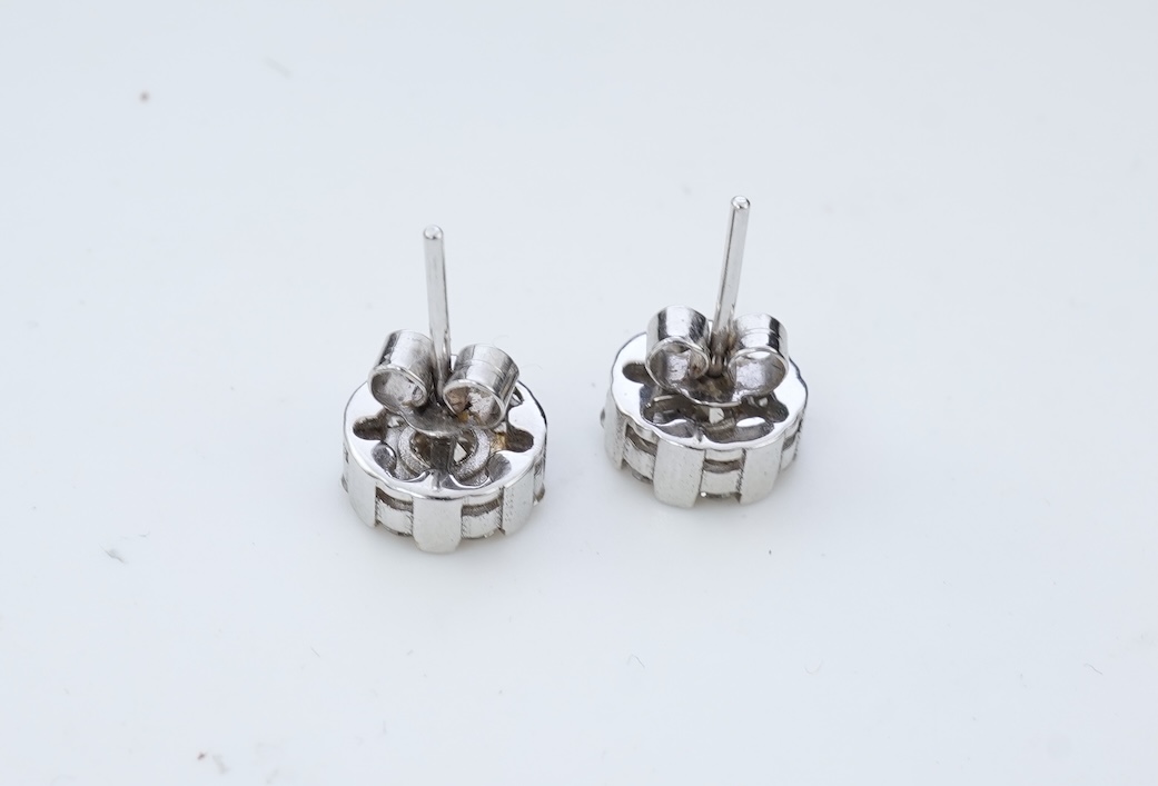 A pair of diamond stud earrings